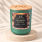 Bourbon Coffee 12 oz soy candle in a matte green glass jar with a crackling wood wick and engraved wood lid